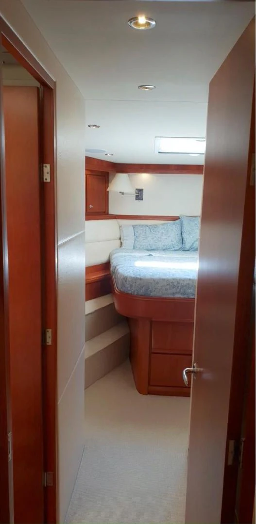 a room with a bed and a door aboard BOUKI Yacht for Sale