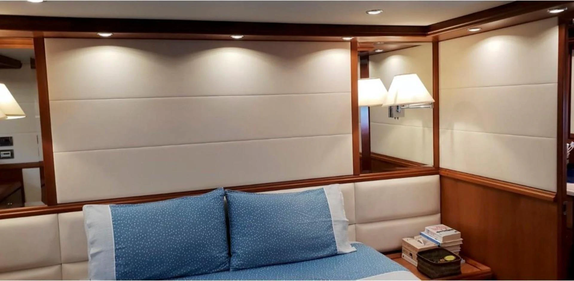 a bed with a blue pillow aboard BOUKI Yacht for Sale