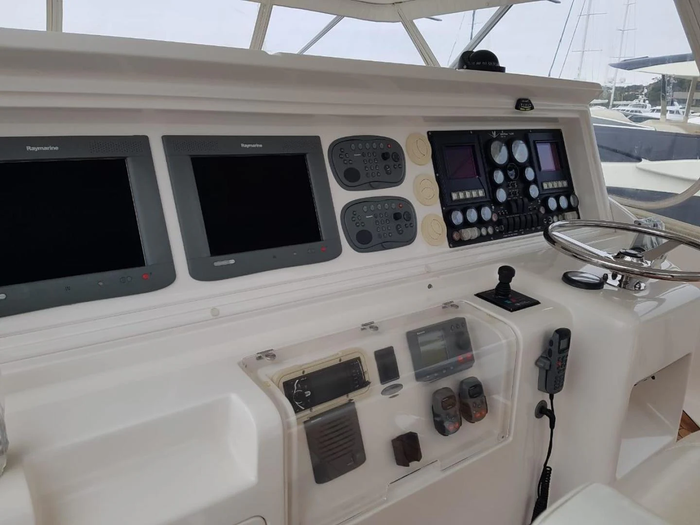 a white paneled panel with black buttons and a white panel with black buttons aboard BOUKI Yacht for Sale