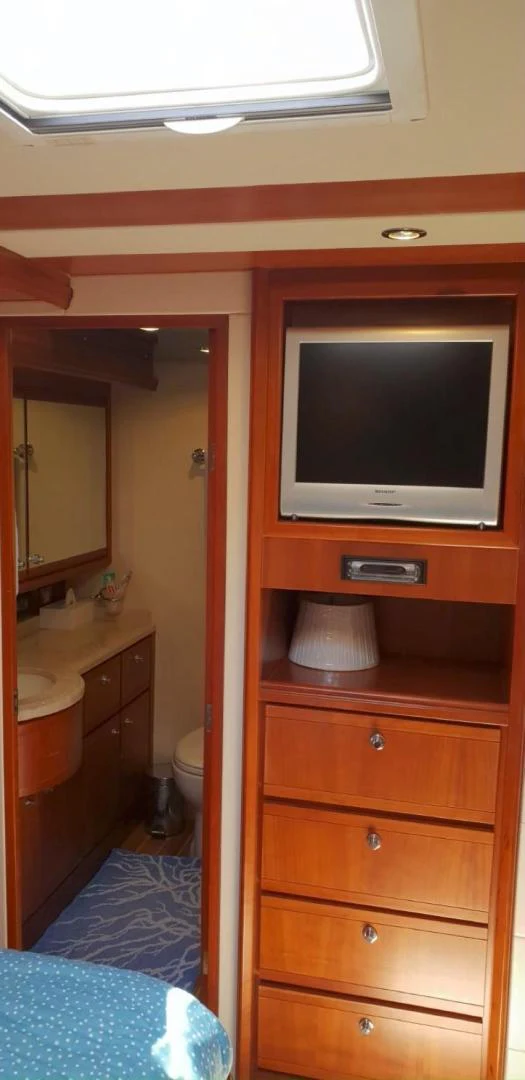 a tv on a dresser aboard BOUKI Yacht for Sale