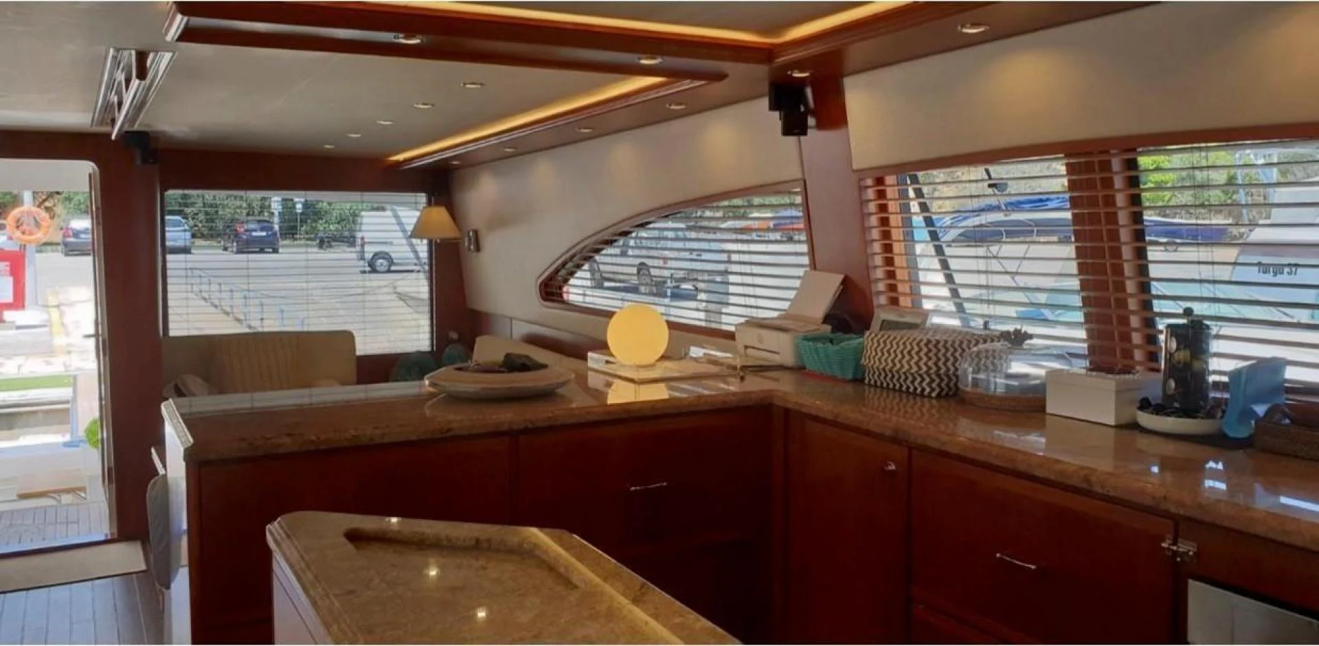 a kitchen with a large window aboard BOUKI Yacht for Sale