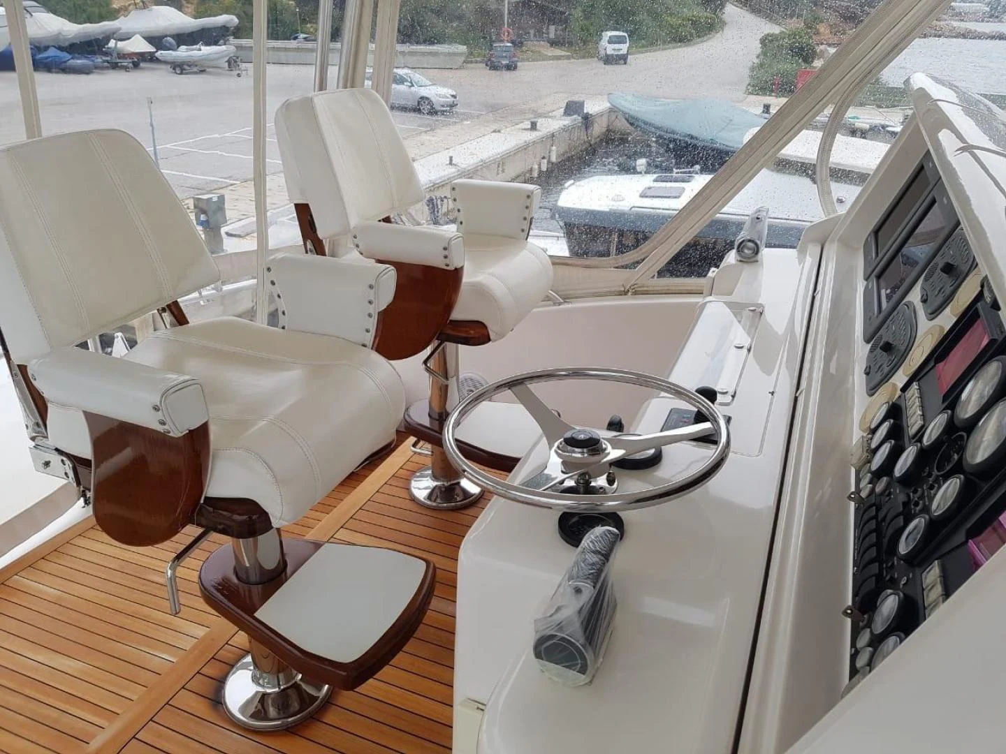 a car with a sink and chairs aboard BOUKI Yacht for Sale