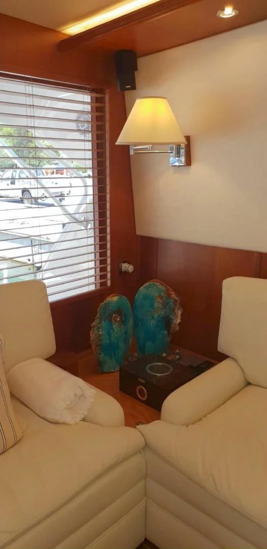 a living room with a lamp and a couch aboard BOUKI Yacht for Sale