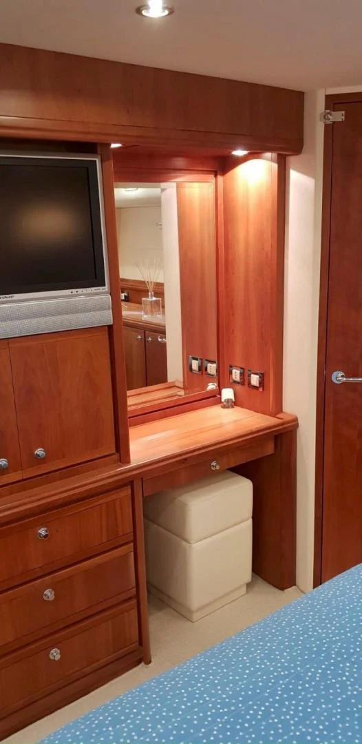 a bathroom with a tv and a mirror aboard BOUKI Yacht for Sale