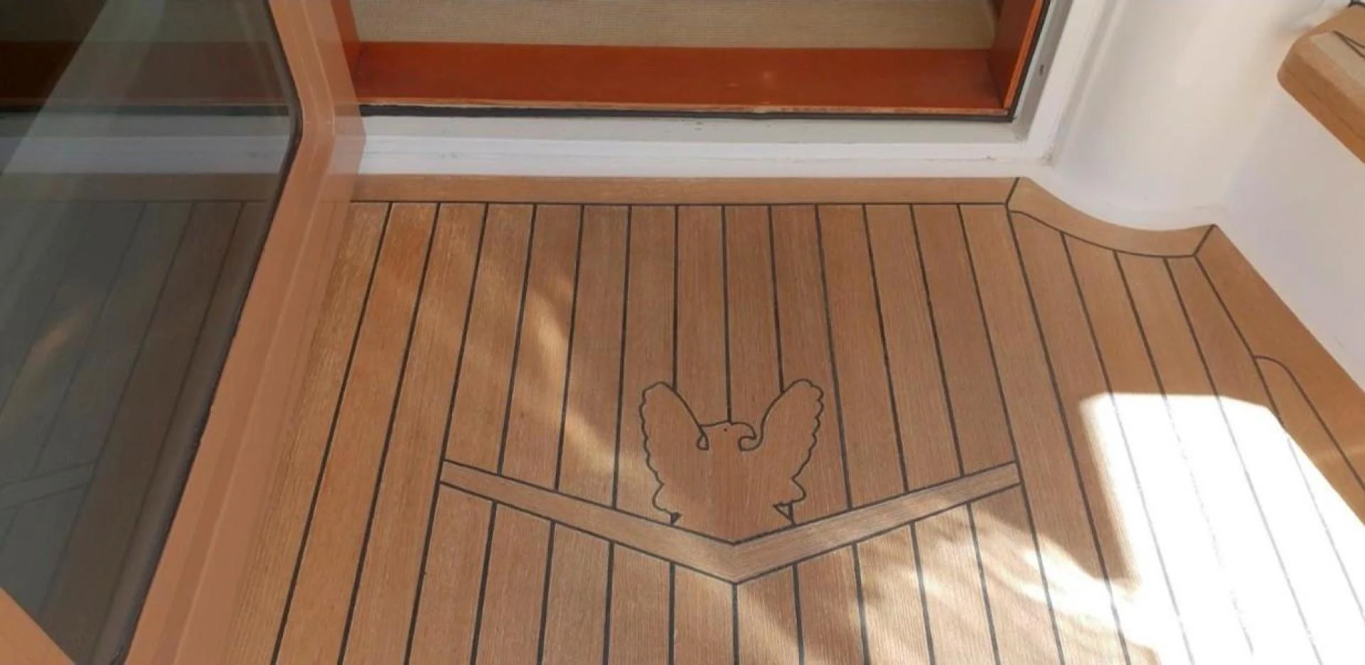 a wood floor with a drawing on it aboard BOUKI Yacht for Sale