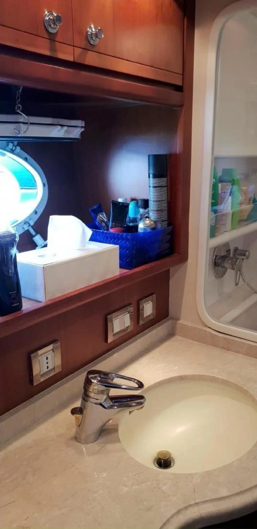 a bathroom sink with a mirror above it aboard BOUKI Yacht for Sale