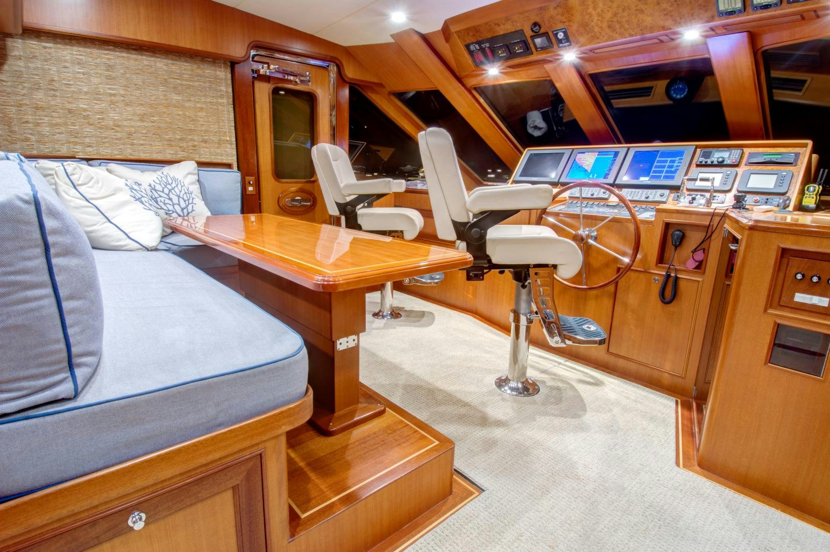 a room with a couch and desk aboard No Name Yacht for Sale
