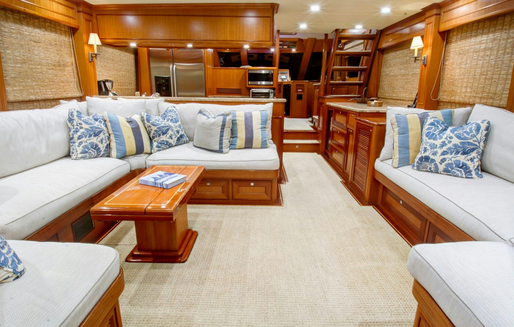 a living room with a couch and a coffee table aboard No Name Yacht for Sale