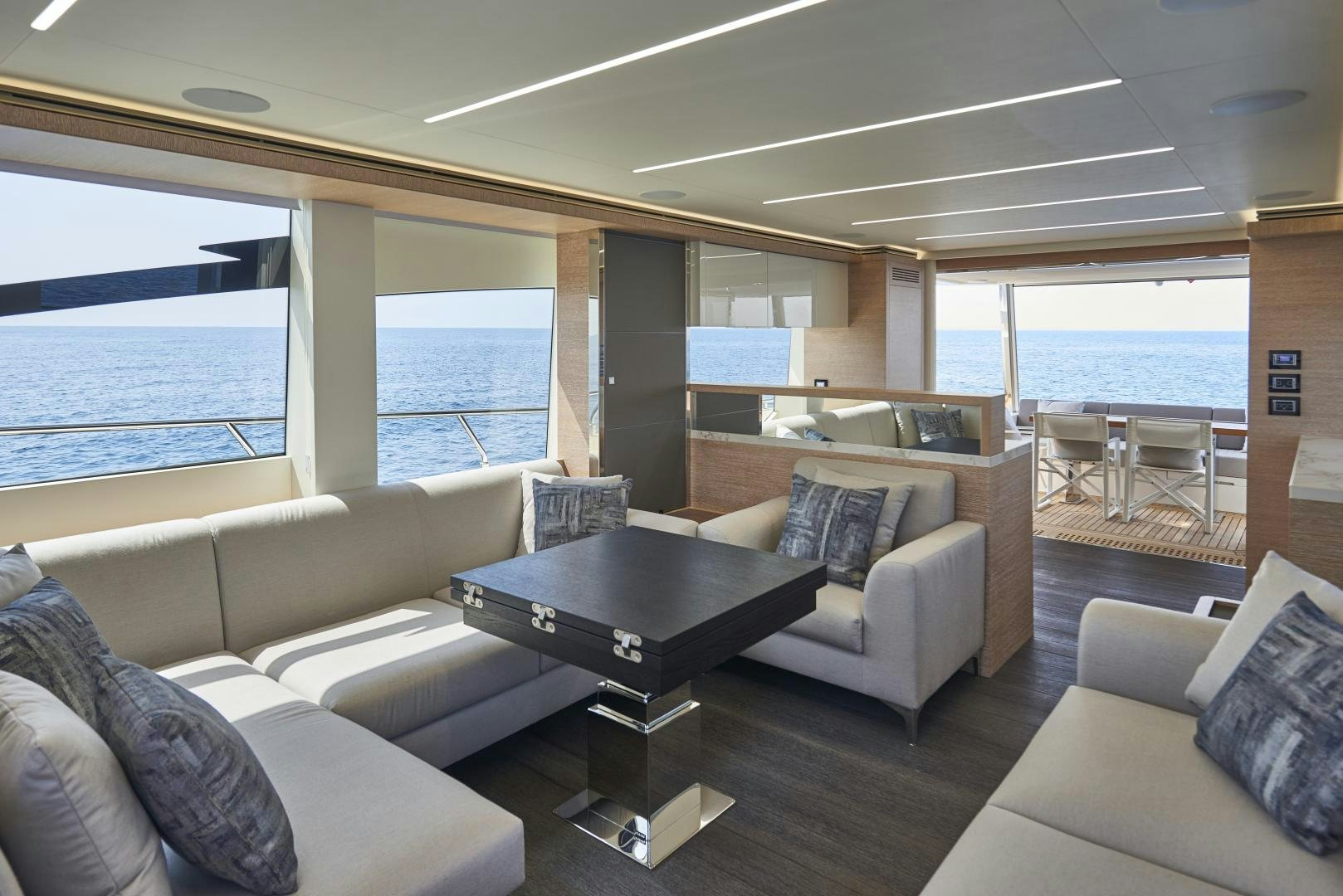 a living room with a large window aboard No Name Yacht for Sale