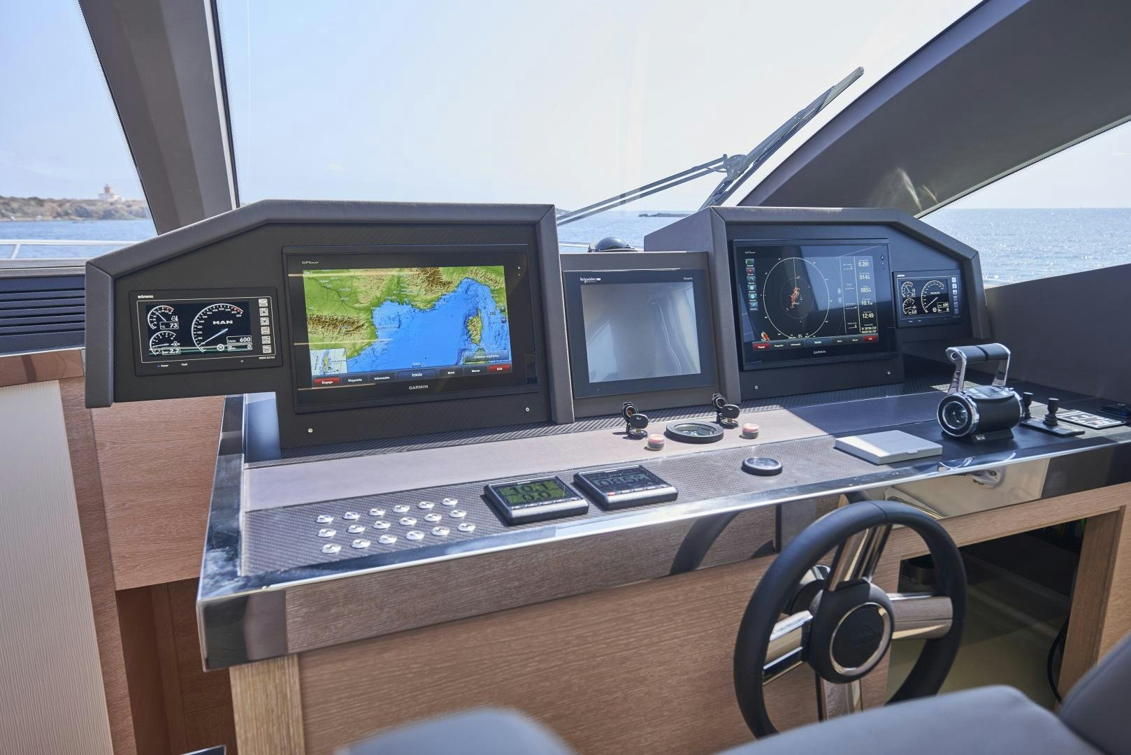 a group of monitors on a table aboard No Name Yacht for Sale