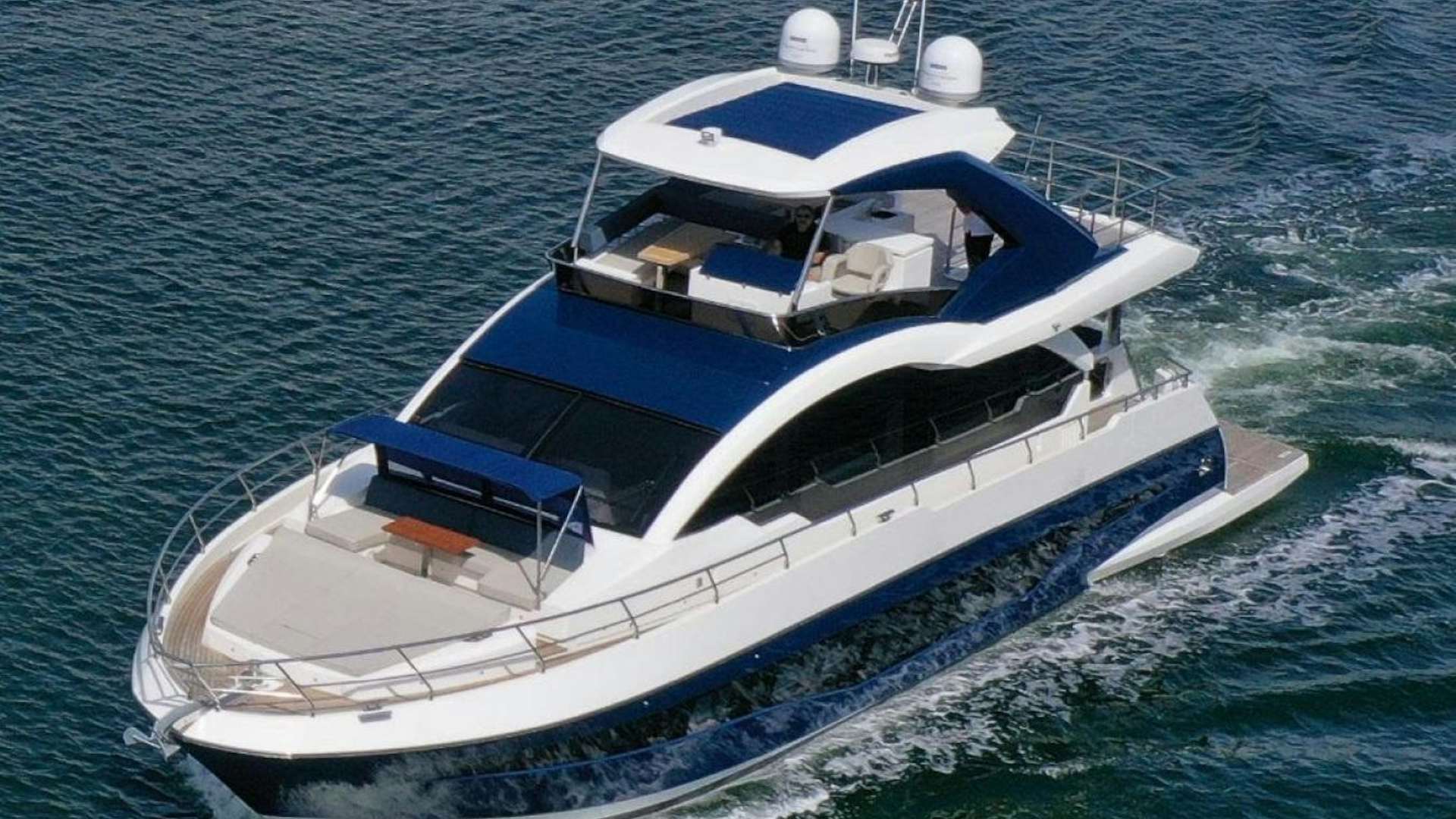a boat on the water aboard THE ONLY BLUE 66 FLY Yacht for Sale