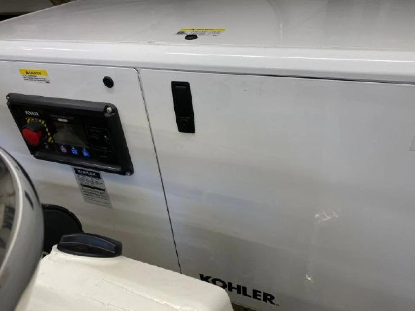 a white car with a black screen aboard THE ONLY BLUE 66 FLY Yacht for Sale