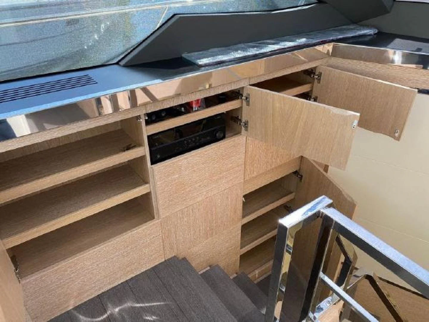 a wooden shelf with a vent aboard THE ONLY BLUE 66 FLY Yacht for Sale