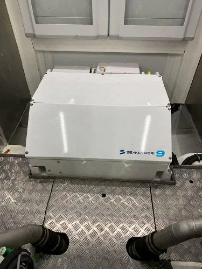 a white rectangular object with a black object on top of it aboard THE ONLY BLUE 66 FLY Yacht for Sale