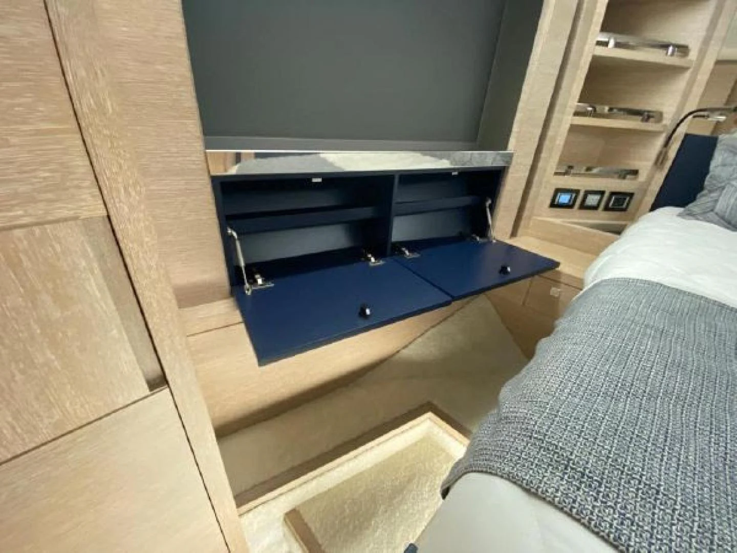 a bed with a desk aboard THE ONLY BLUE 66 FLY Yacht for Sale