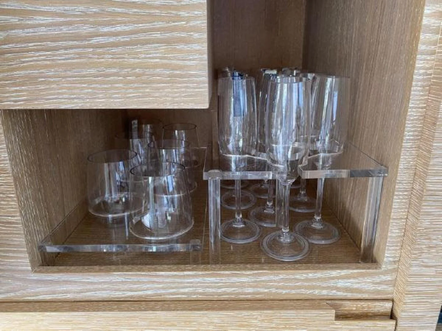 a group of glasses on a shelf aboard THE ONLY BLUE 66 FLY Yacht for Sale