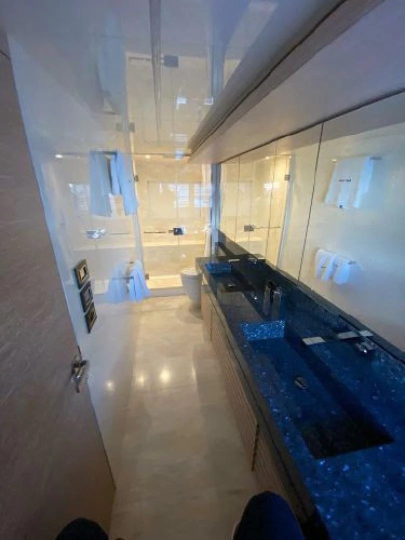 a bathroom with a pool aboard THE ONLY BLUE 66 FLY Yacht for Sale