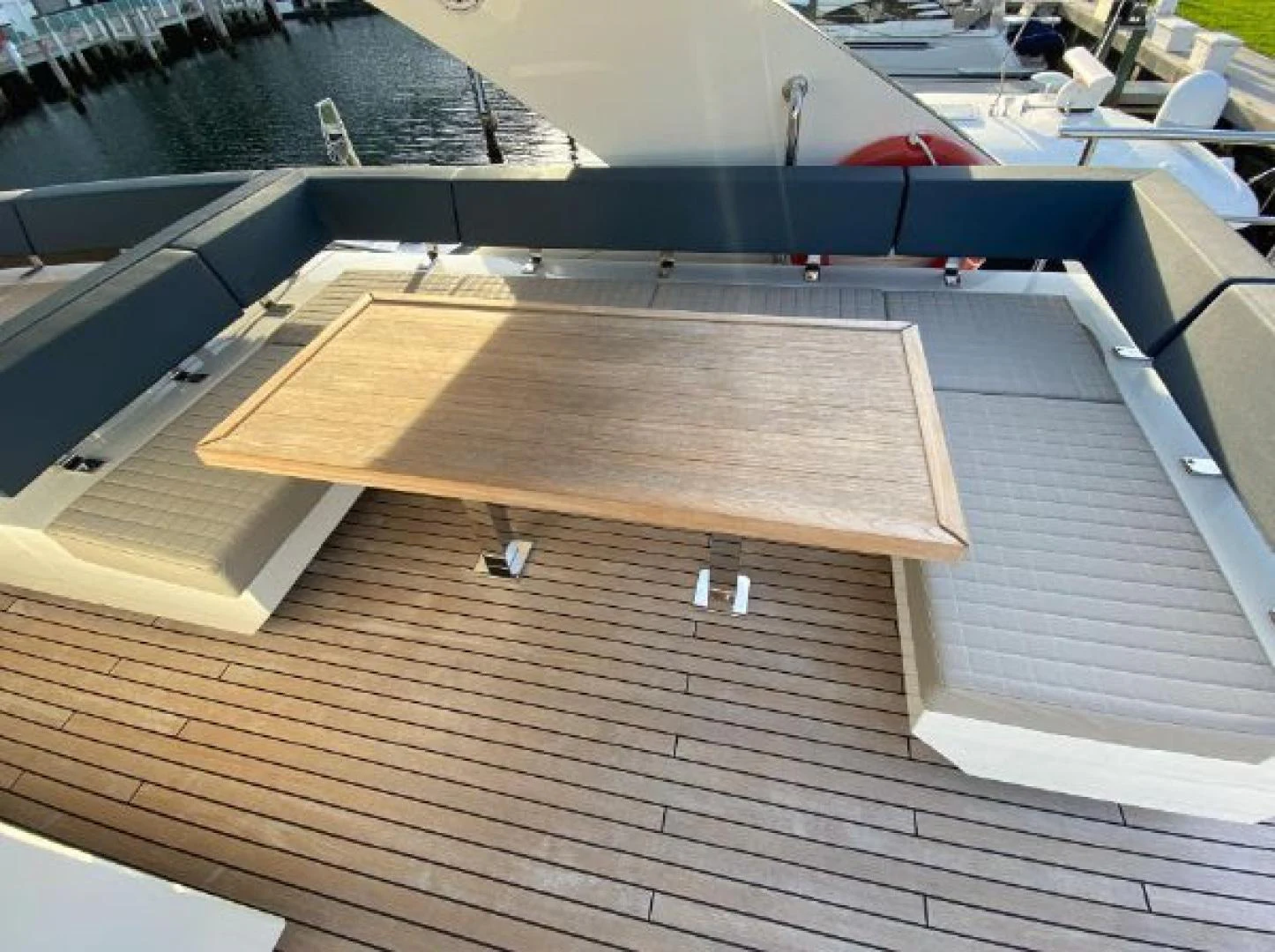 a deck with a deck and a pool aboard THE ONLY BLUE 66 FLY Yacht for Sale