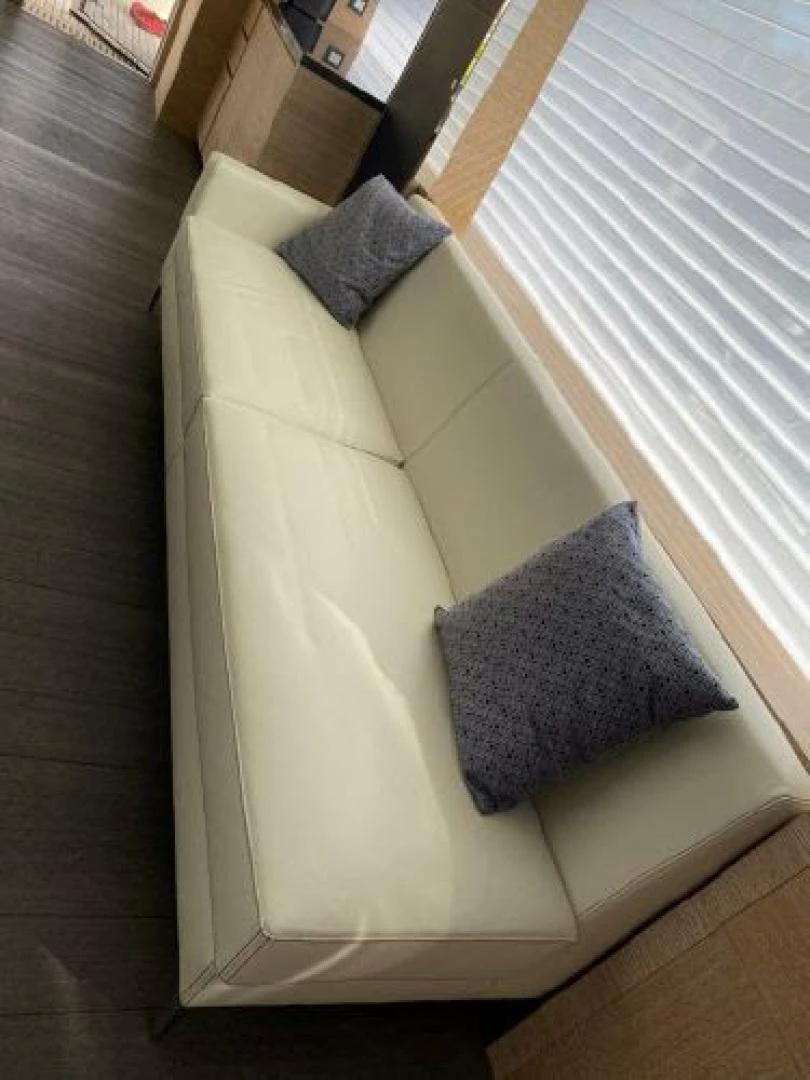 a couch with pillows aboard THE ONLY BLUE 66 FLY Yacht for Sale
