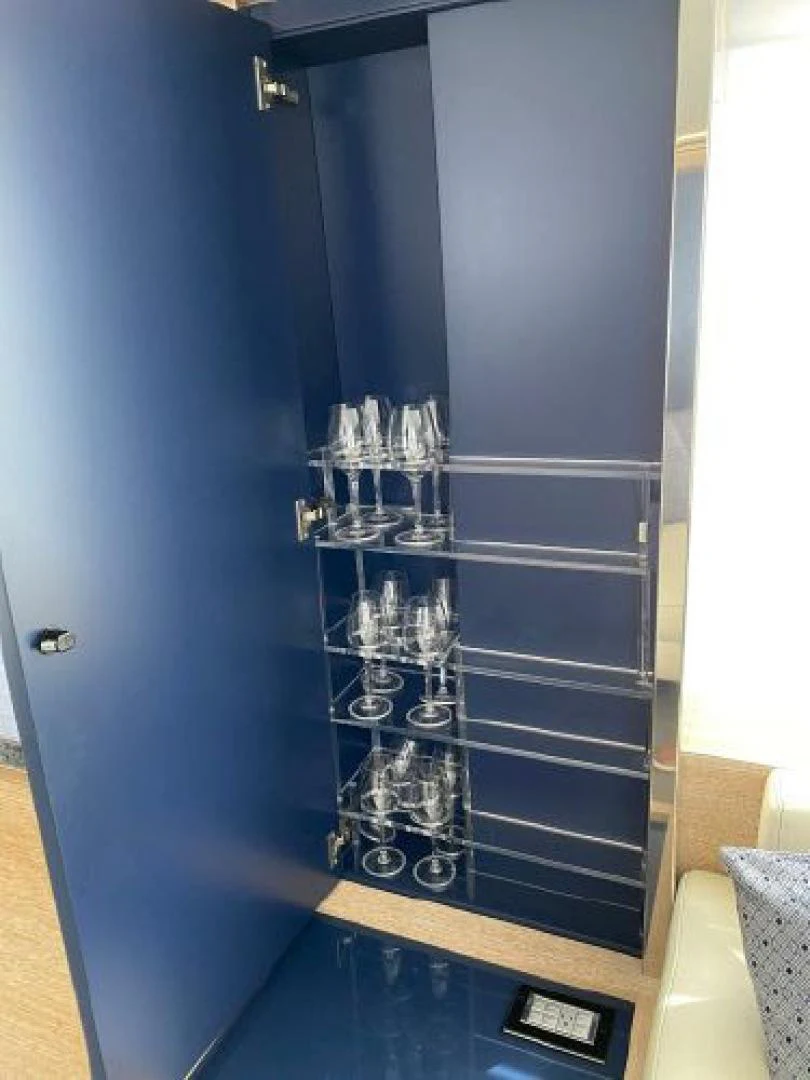 a glass cabinet with a clear door aboard THE ONLY BLUE 66 FLY Yacht for Sale