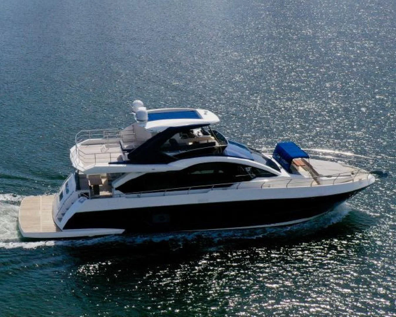 a boat in the water aboard THE ONLY BLUE 66 FLY Yacht for Sale