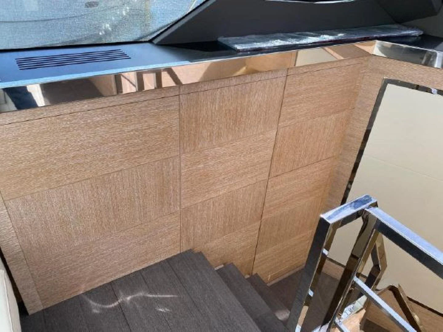 a wooden cabinet with a shelf aboard THE ONLY BLUE 66 FLY Yacht for Sale