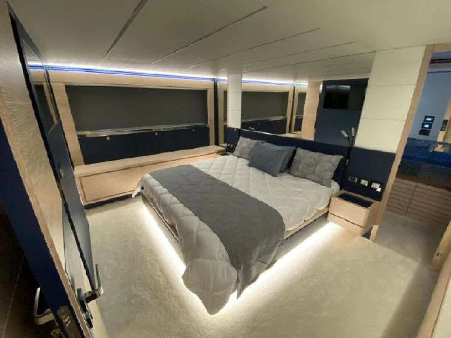 a bed in a room aboard THE ONLY BLUE 66 FLY Yacht for Sale