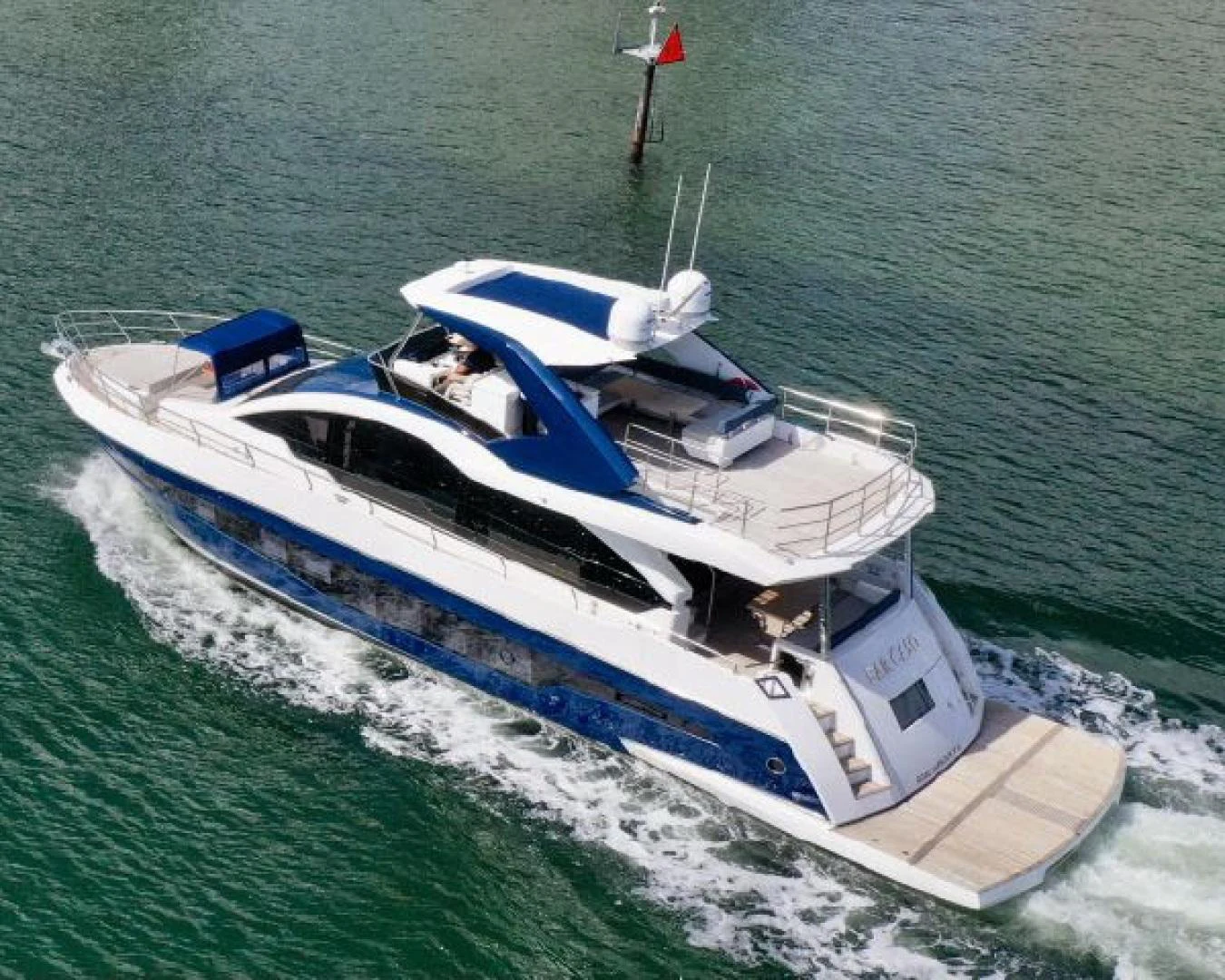 a boat on the water aboard THE ONLY BLUE 66 FLY Yacht for Sale