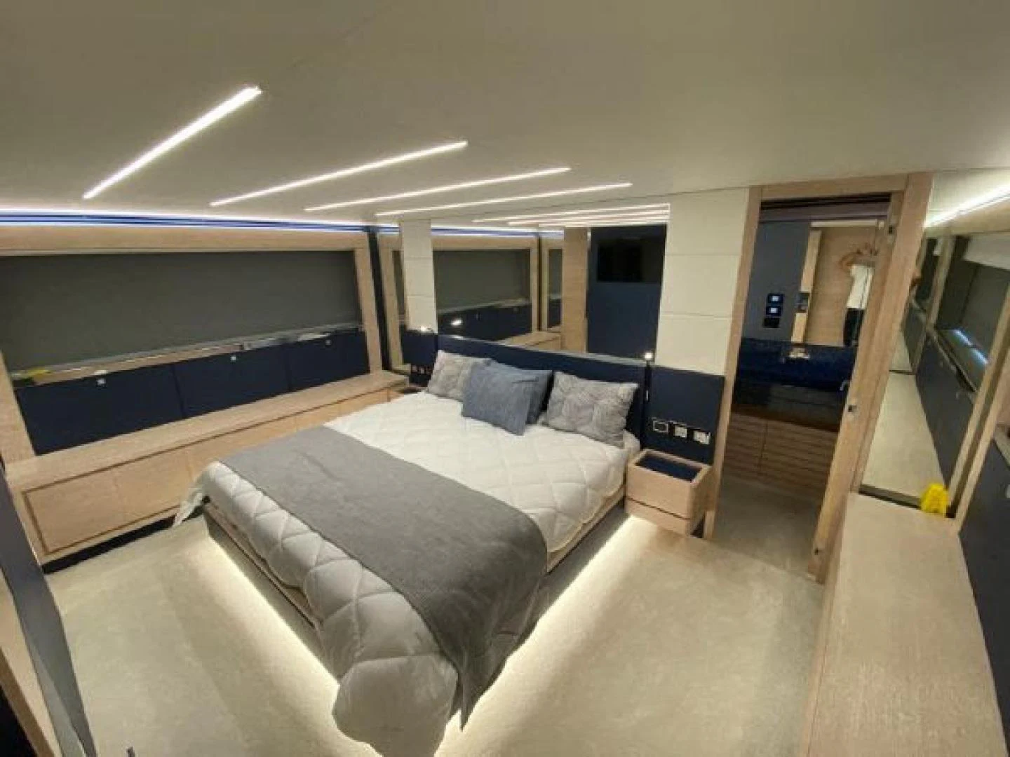 a room with a bed and a desk aboard THE ONLY BLUE 66 FLY Yacht for Sale