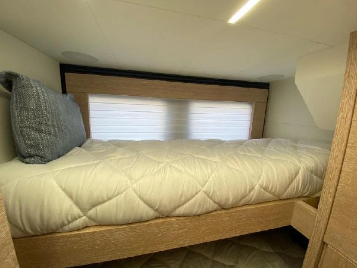 a couch in a room aboard THE ONLY BLUE 66 FLY Yacht for Sale