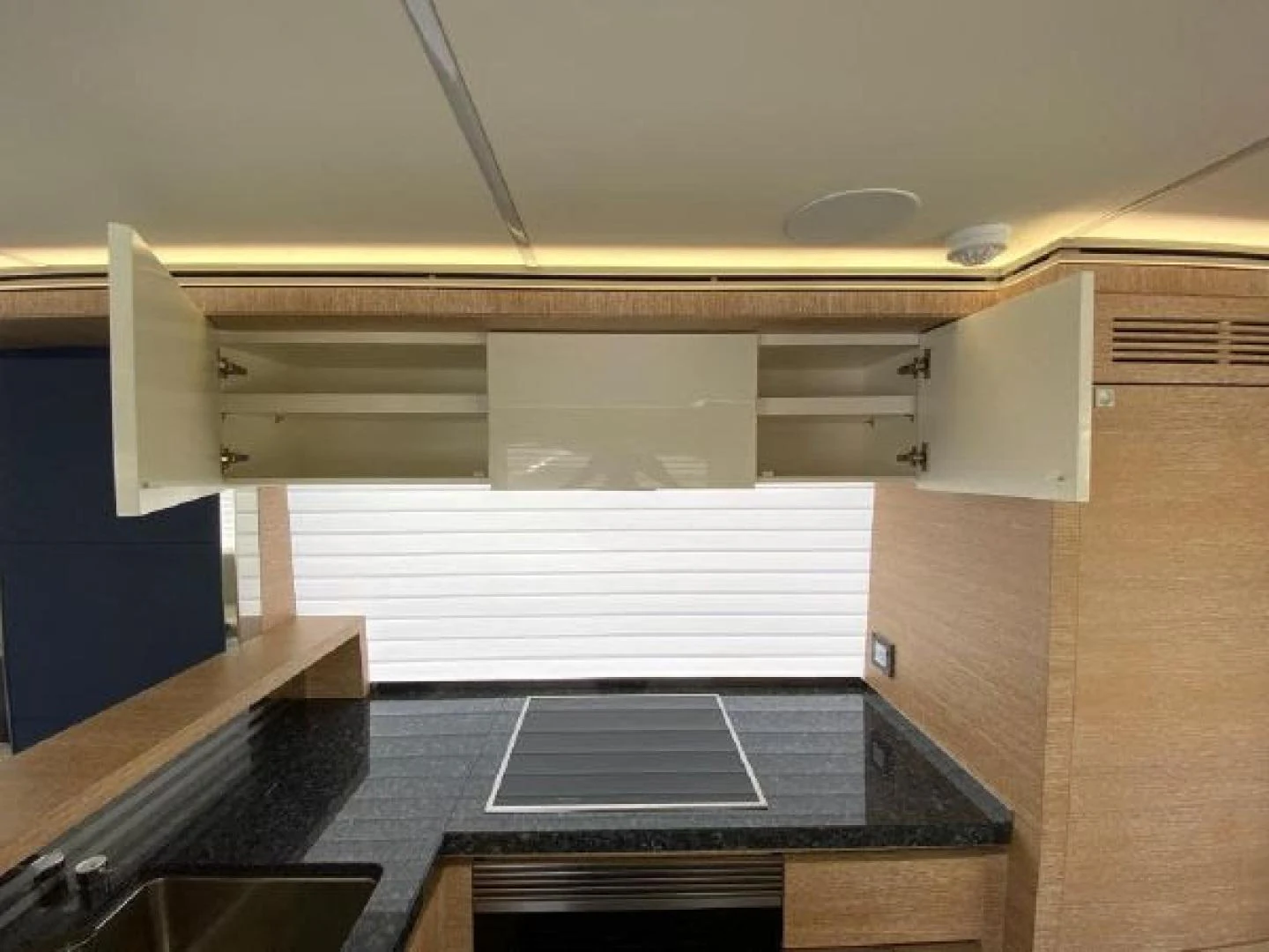 a room with a large counter aboard THE ONLY BLUE 66 FLY Yacht for Sale