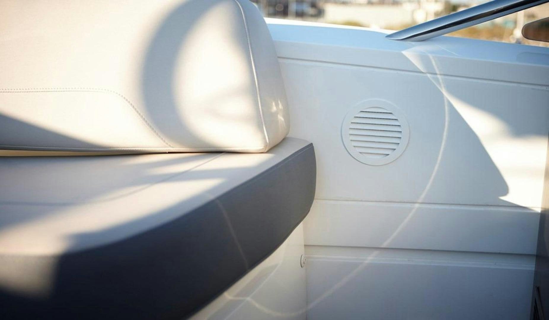 the tail end of a white car aboard Namaste Yacht for Sale