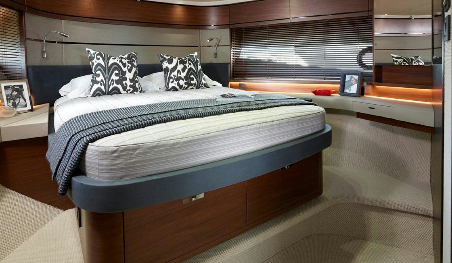 a bed with a blue cover aboard Namaste Yacht for Sale