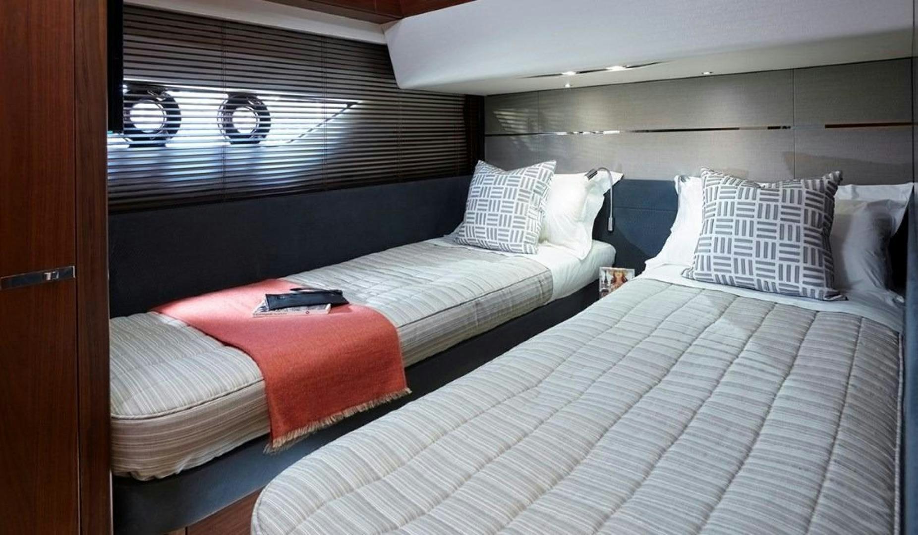 a couple of beds in a room aboard Namaste Yacht for Sale