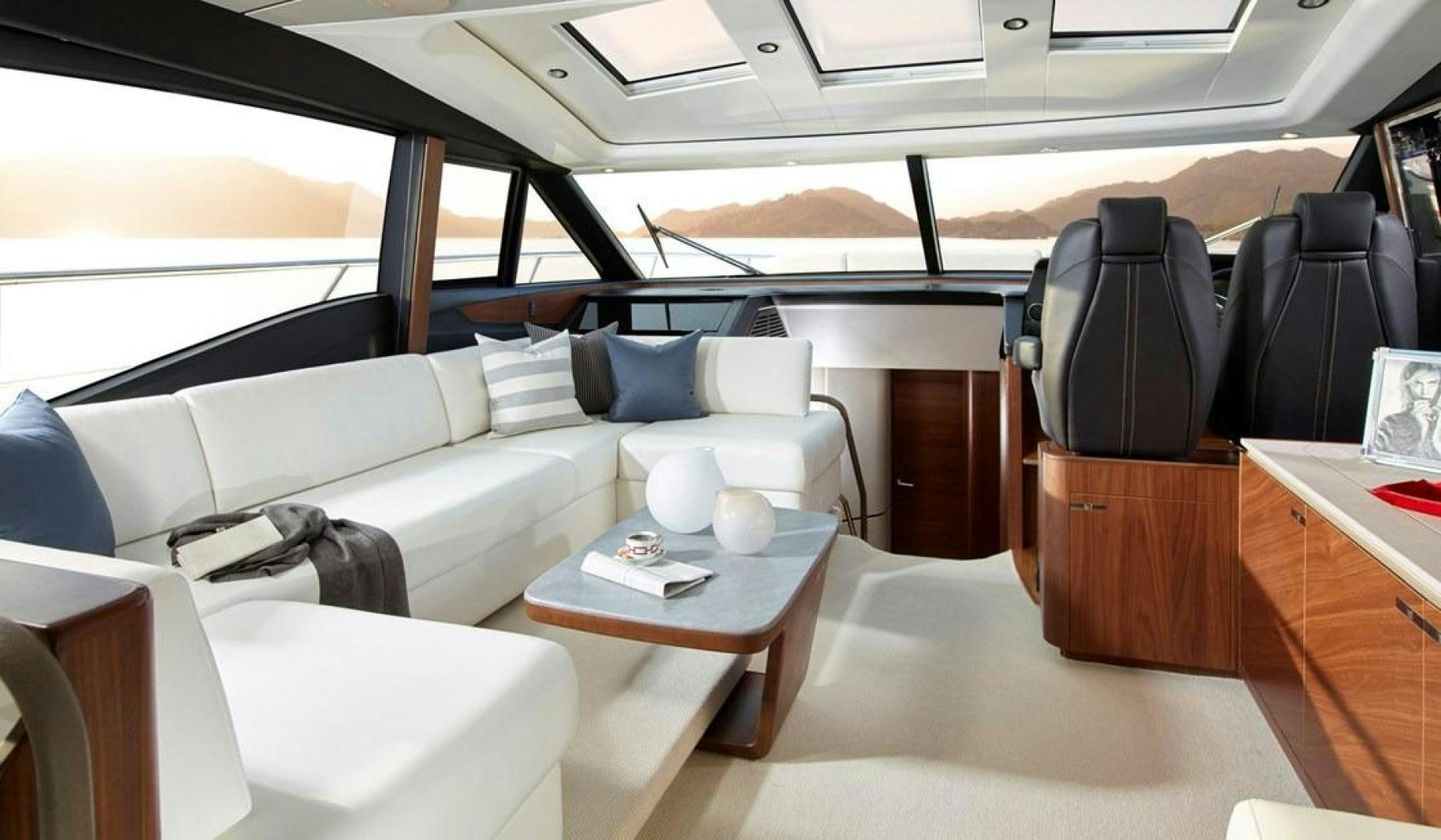 a room with a couch and a table aboard Namaste Yacht for Sale