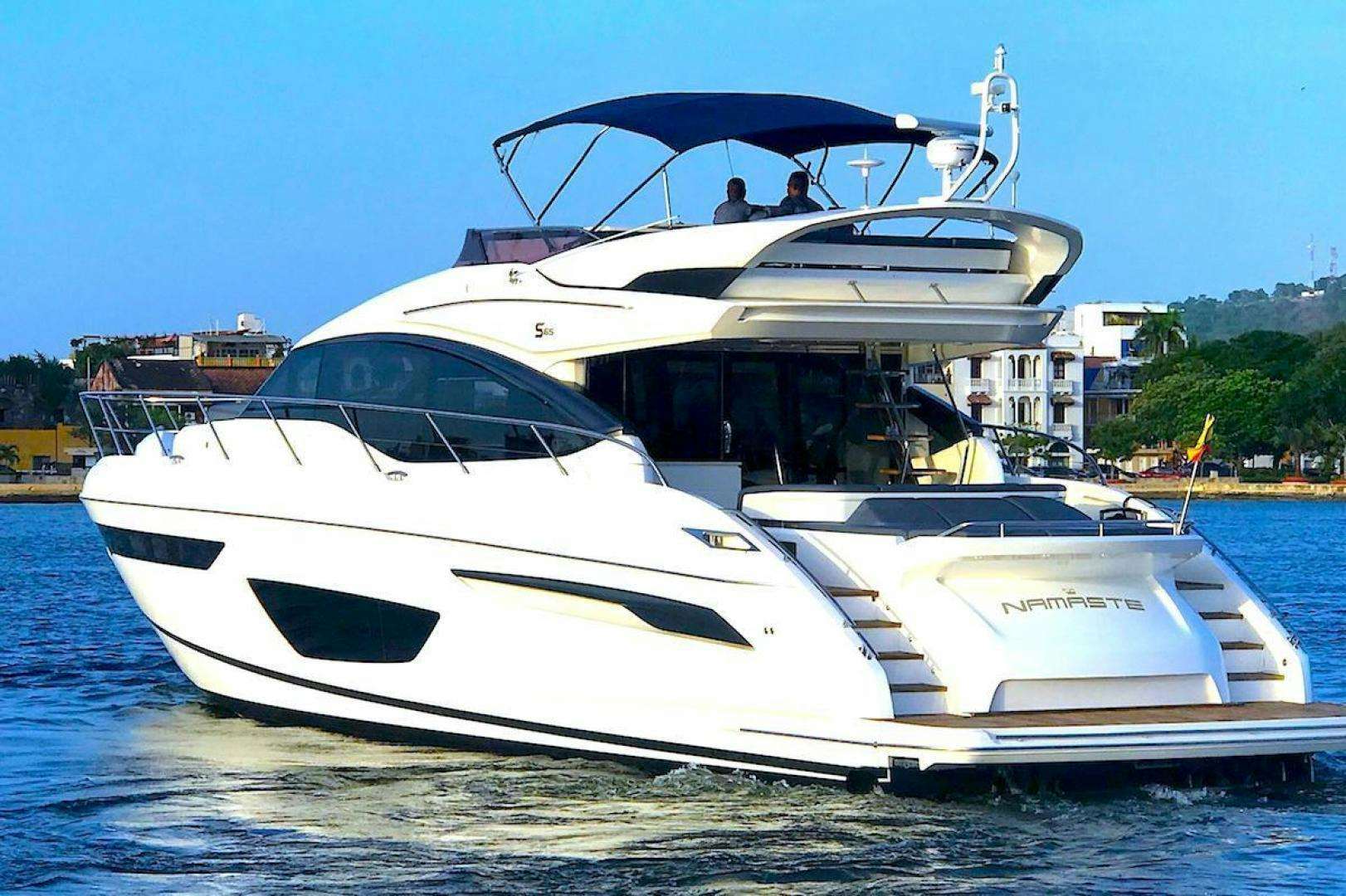 a white yacht on the water aboard Namaste Yacht for Sale