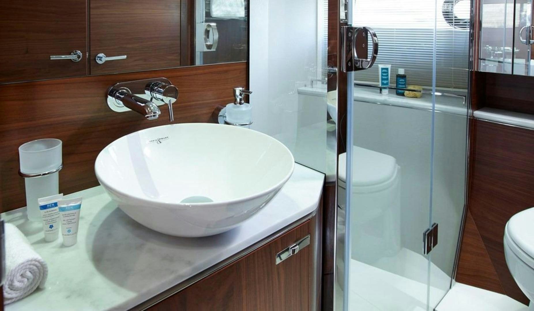 a bathroom with a sink and a shower aboard Namaste Yacht for Sale