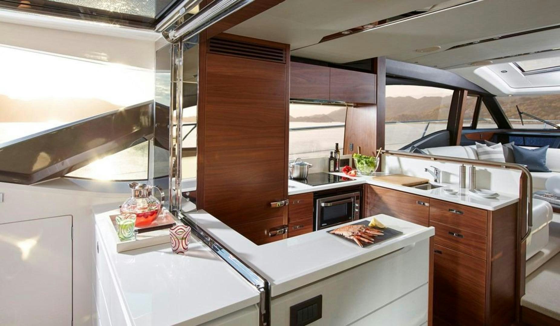 a kitchen with a large window aboard Namaste Yacht for Sale