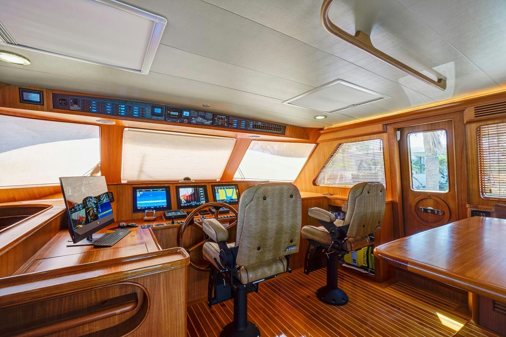 a room with desks and chairs aboard JOAN'S RONDEVOUS Yacht for Sale
