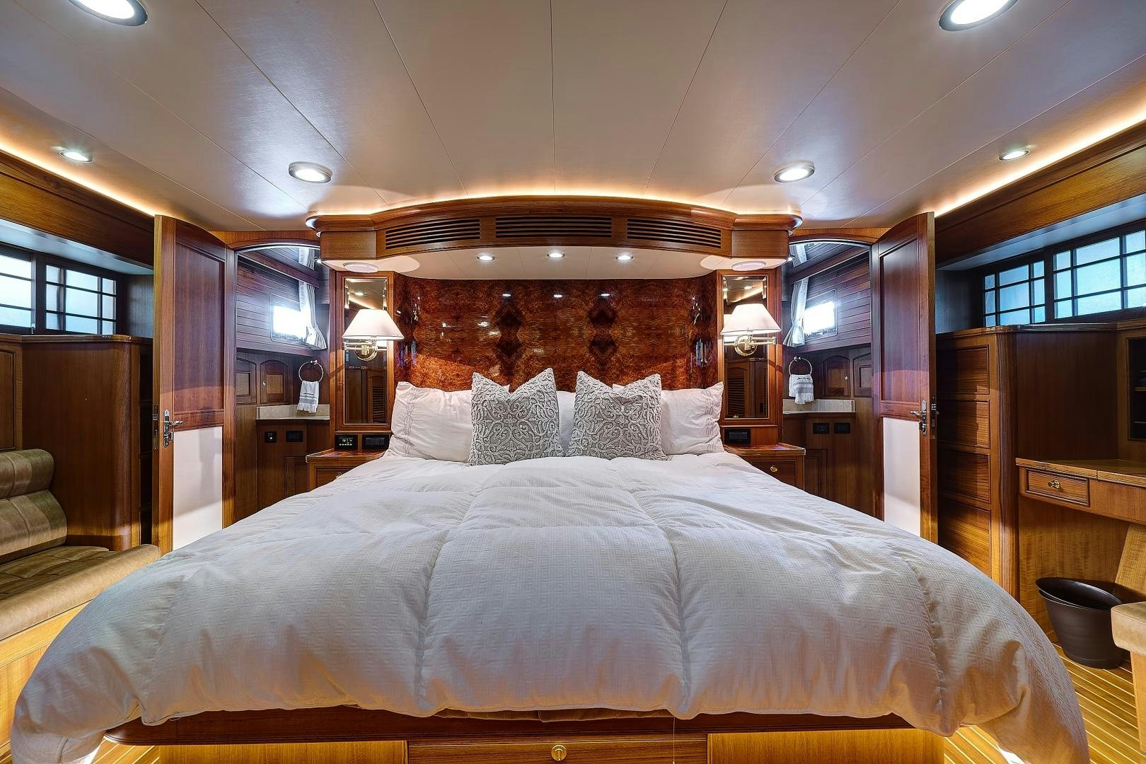 a bed with white sheets aboard JOAN'S RONDEVOUS Yacht for Sale