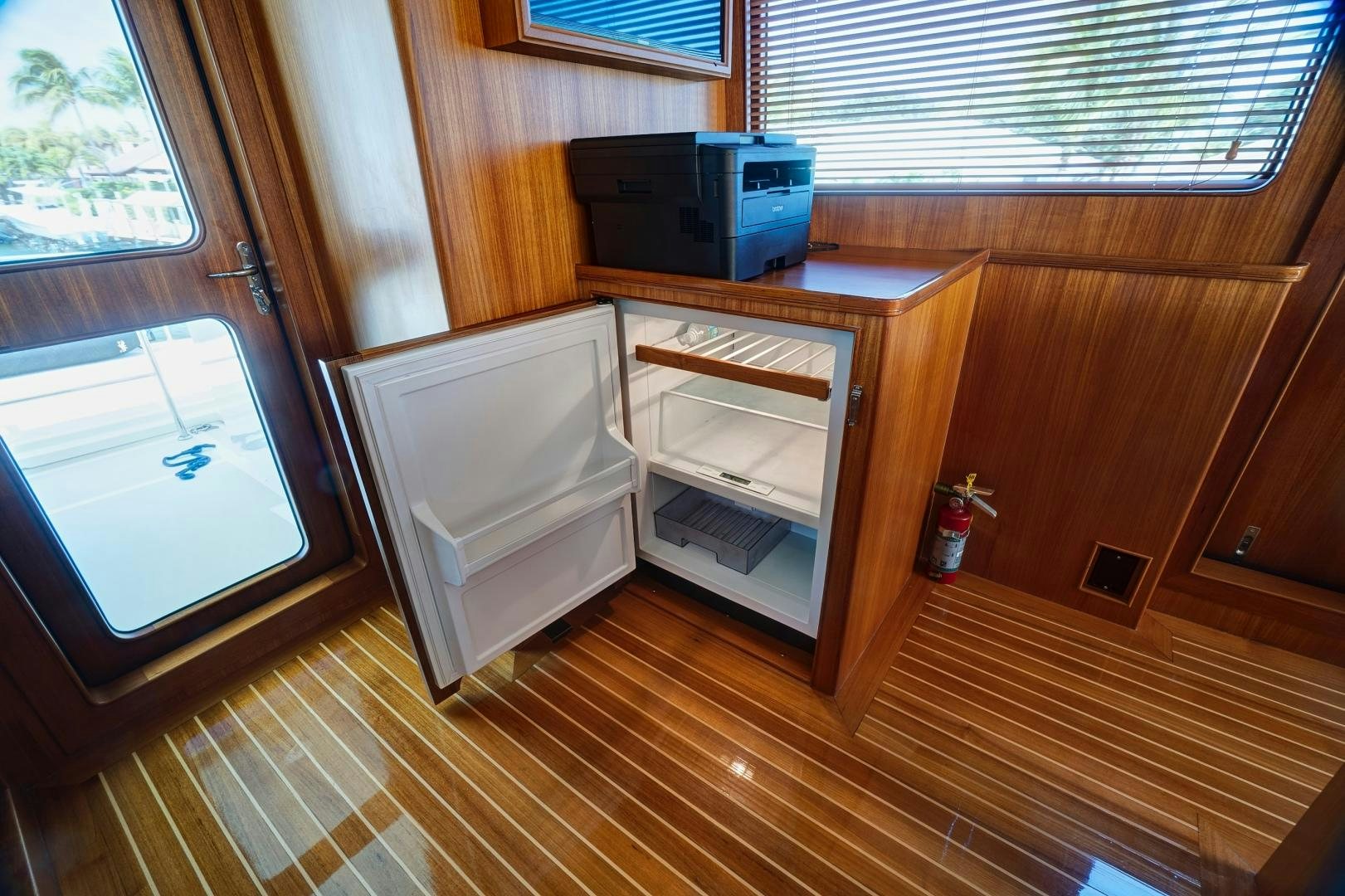 a kitchen with wooden cabinets aboard JOAN'S RONDEVOUS Yacht for Sale