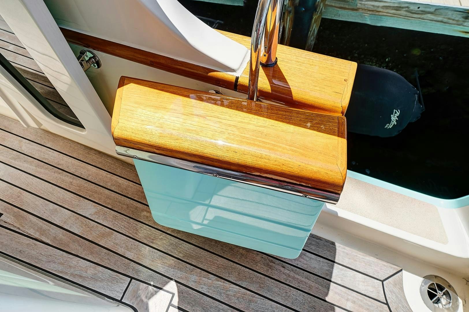 a stack of books on a table aboard JOAN'S RONDEVOUS Yacht for Sale
