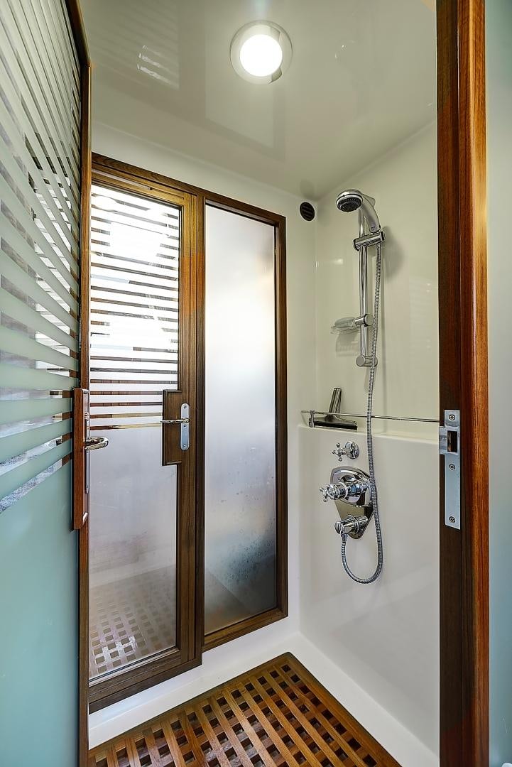 a shower unit with a door aboard JOAN'S RONDEVOUS Yacht for Sale