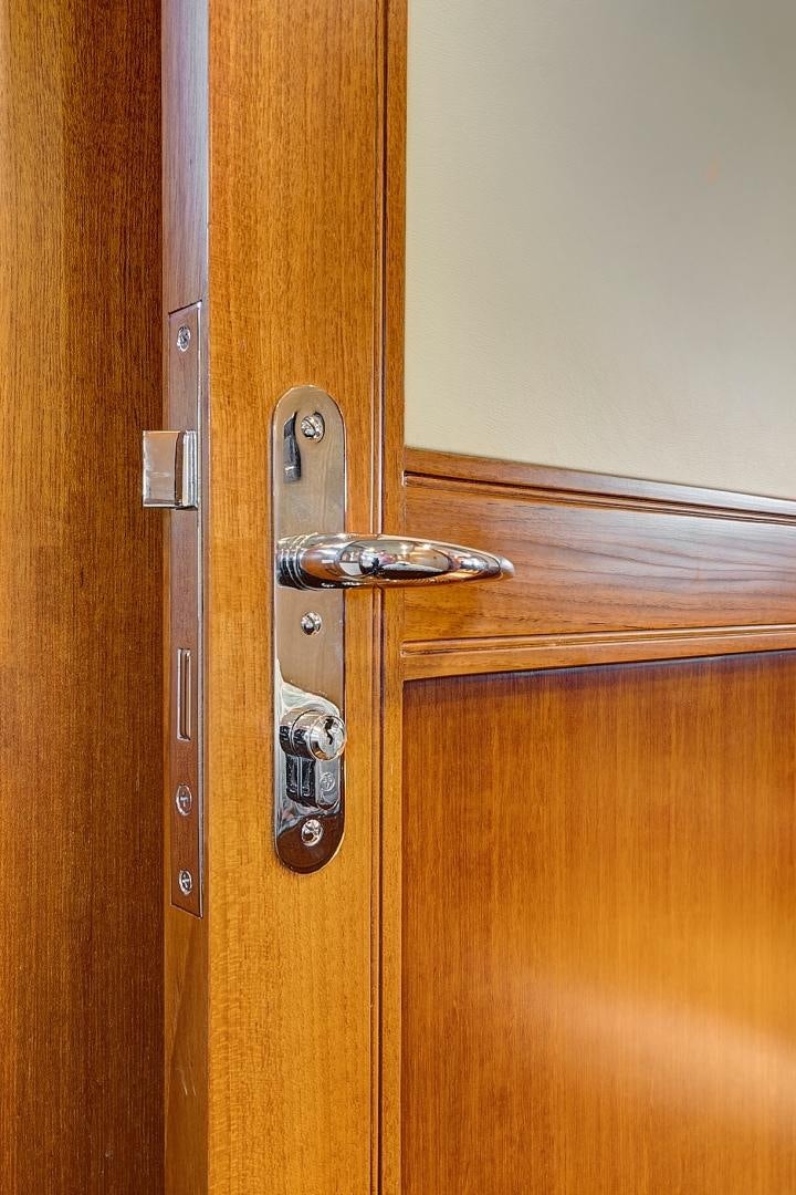 a door with a handle aboard JOAN'S RONDEVOUS Yacht for Sale