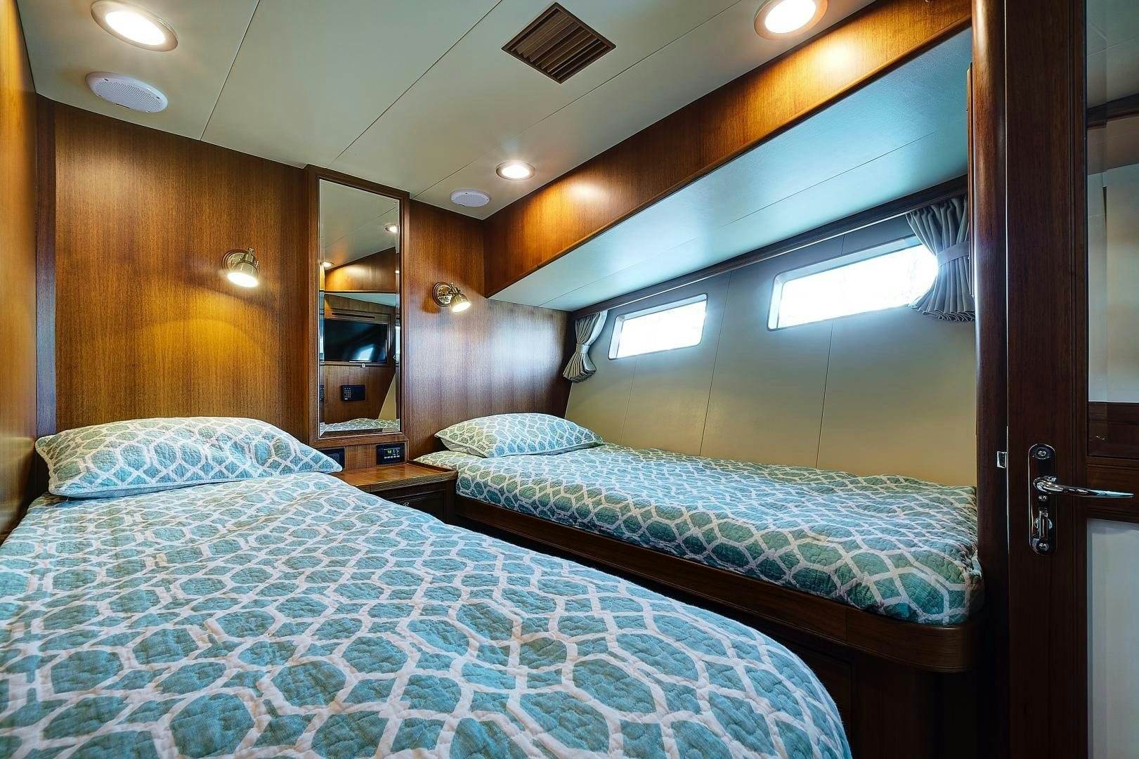 a couple of beds in a room aboard JOAN'S RONDEVOUS Yacht for Sale