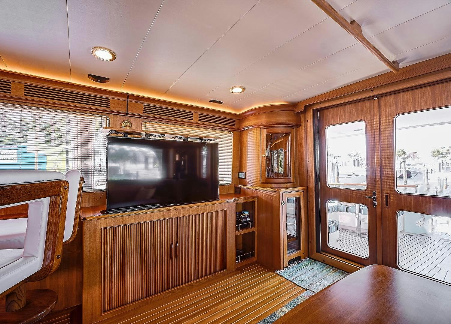 a living room with a tv aboard JOAN'S RONDEVOUS Yacht for Sale