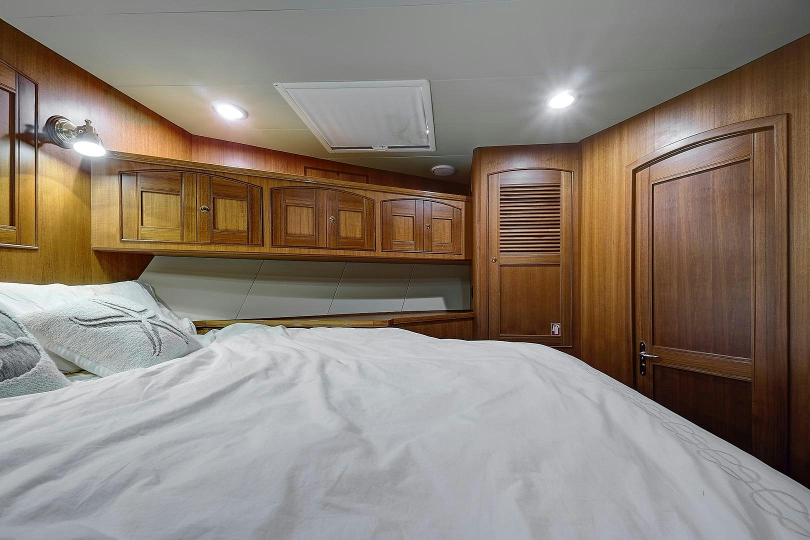 a bed with a white sheet aboard JOAN'S RONDEVOUS Yacht for Sale