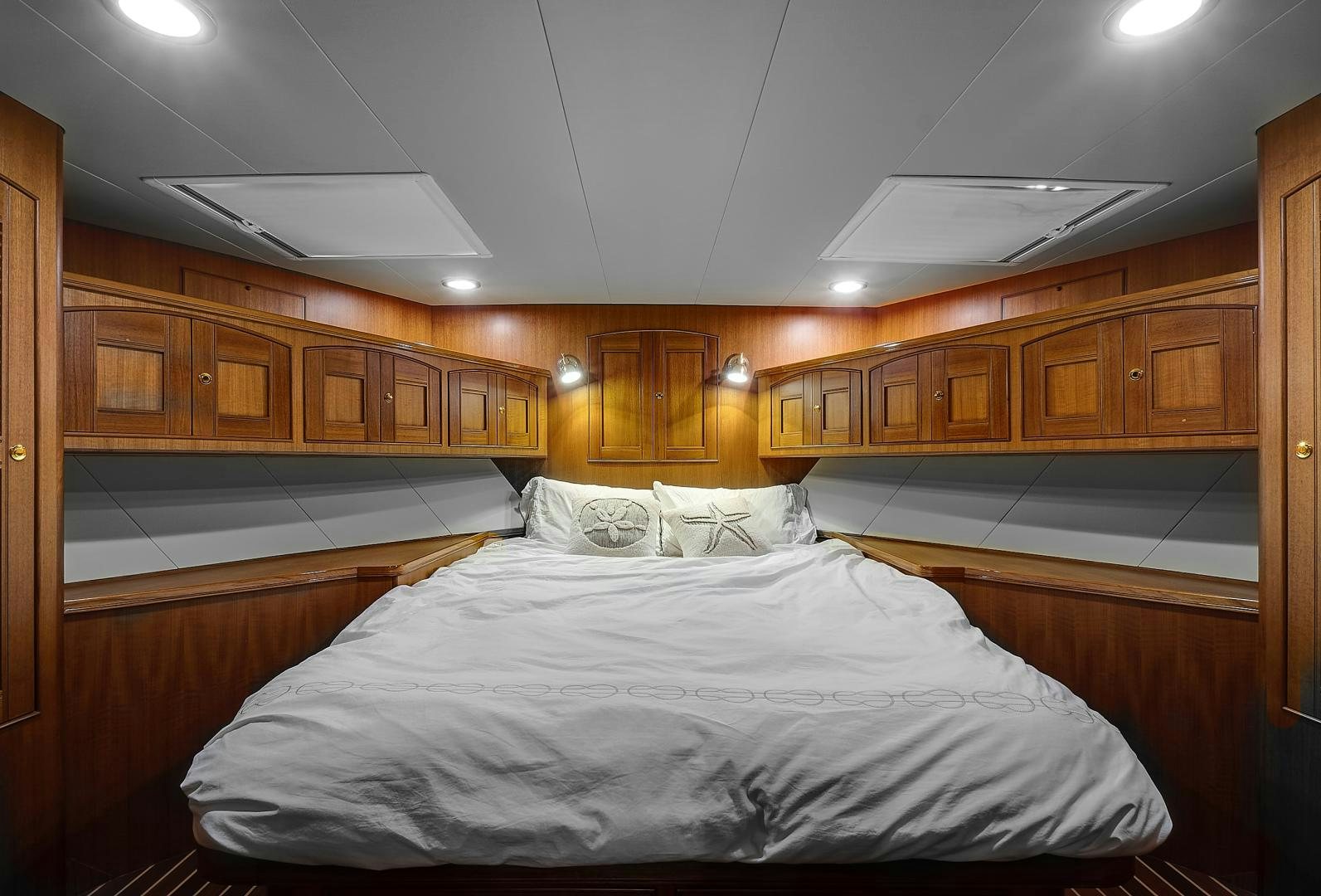 a room with wooden cabinets aboard JOAN'S RONDEVOUS Yacht for Sale