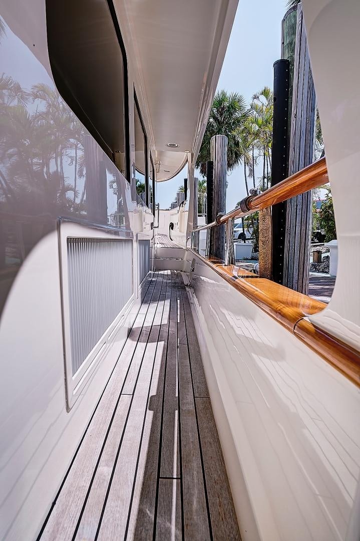 a wooden walkway with a railing aboard JOAN'S RONDEVOUS Yacht for Sale