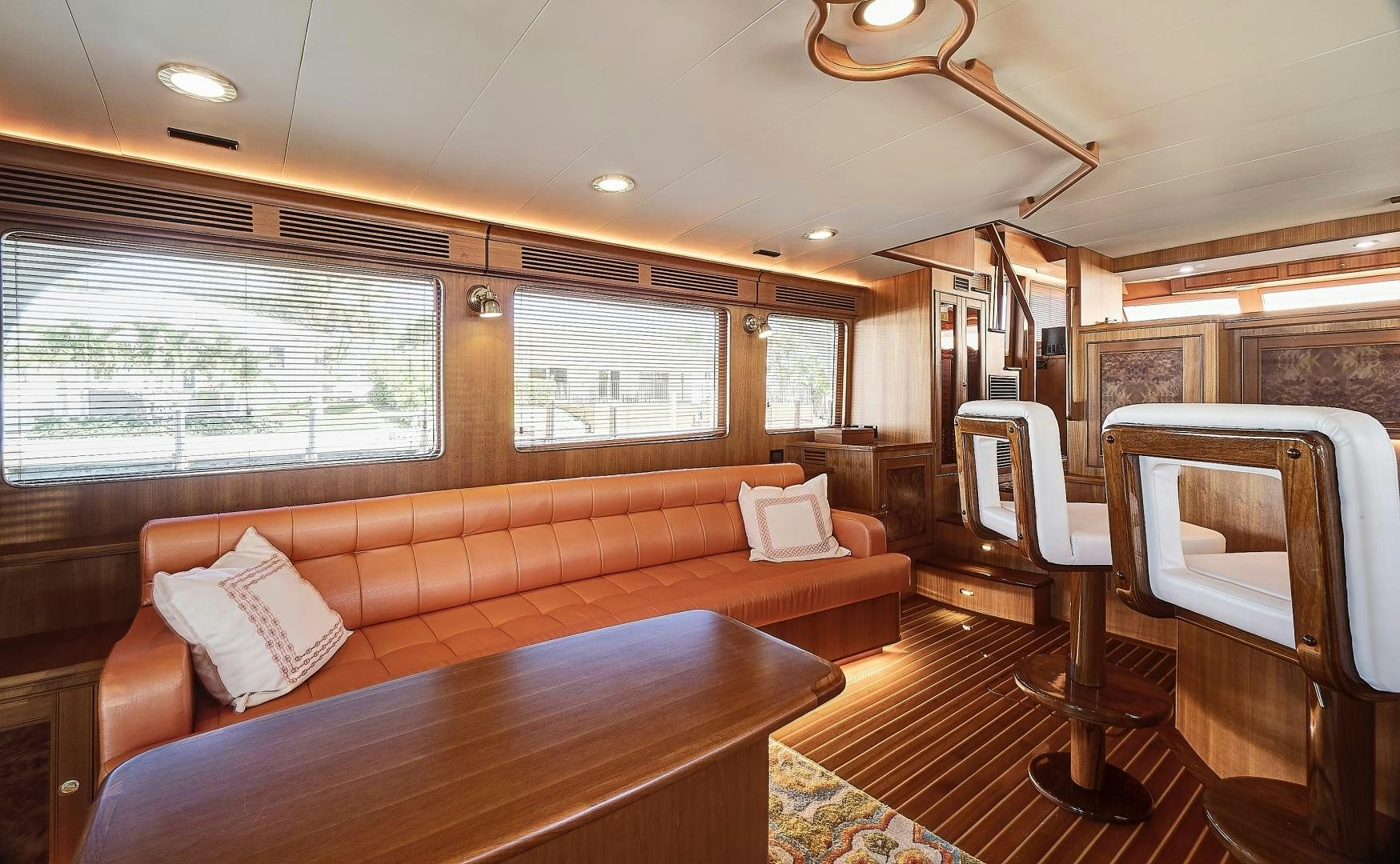 a living room with a couch and a table aboard JOAN'S RONDEVOUS Yacht for Sale